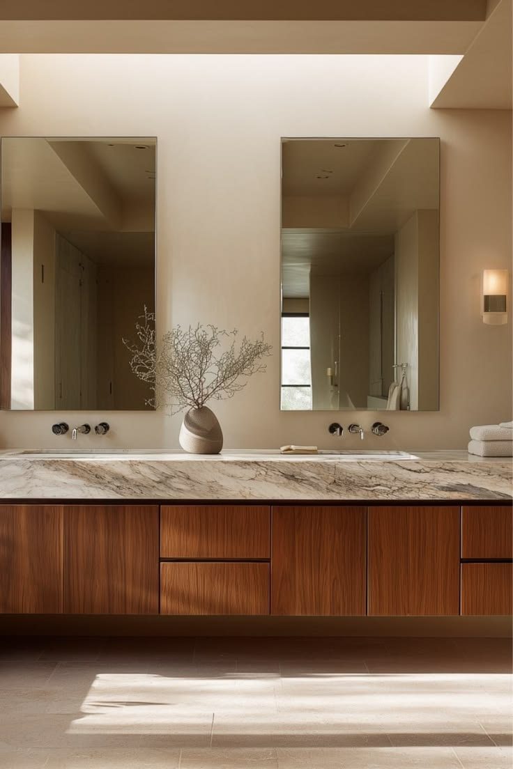 Floating walnut vanity with a marble top