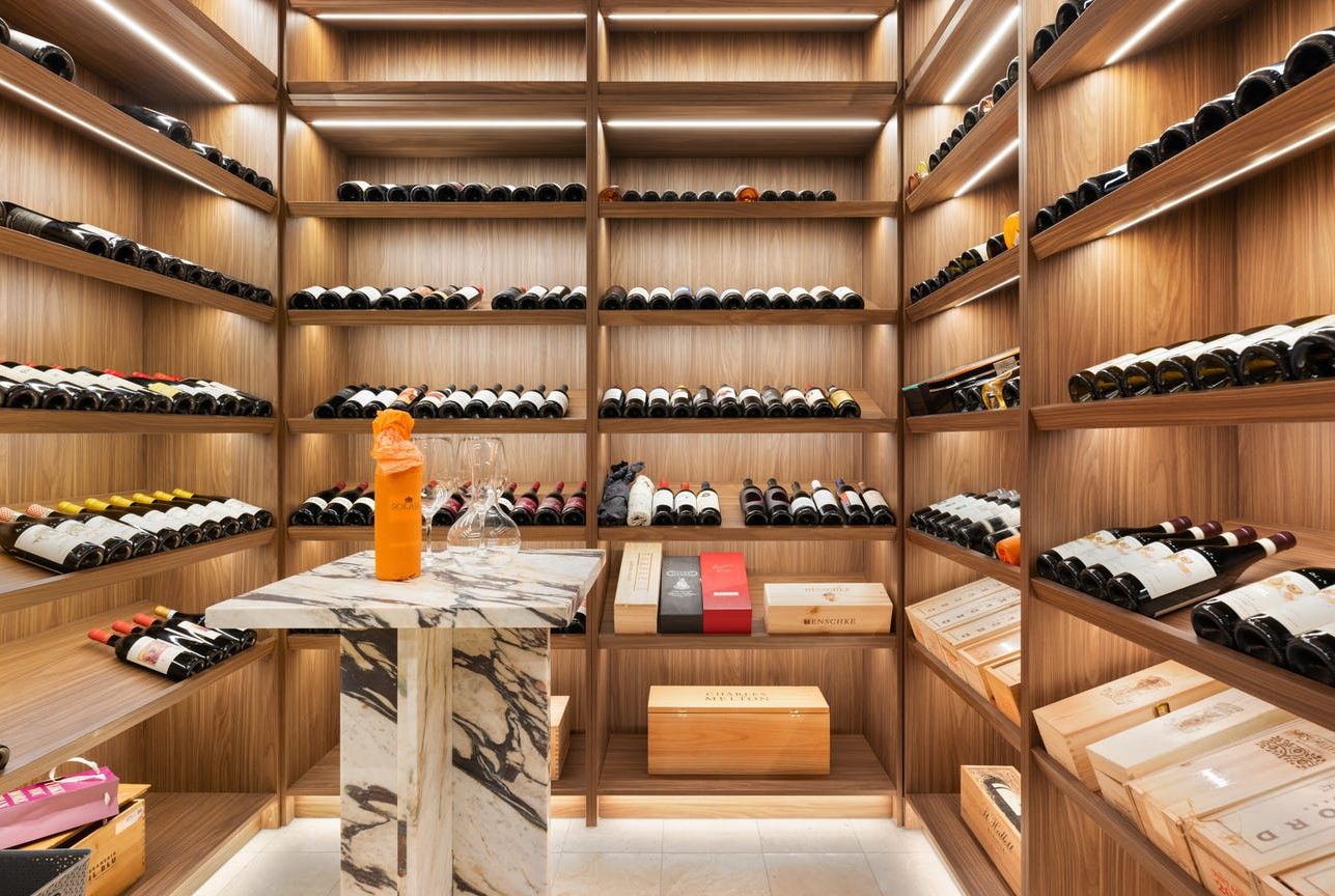 Oak wine room with a marble table